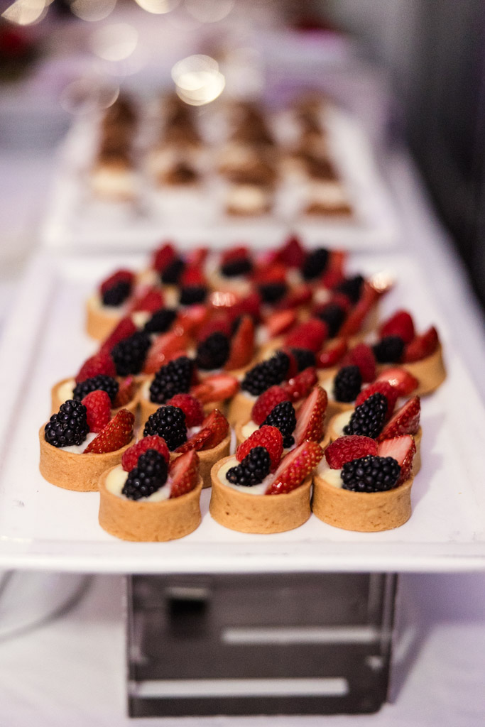 Mini fruit tarts topped with strawberries, raspberries, and blackberries arranged on a white serving tray for wedding reception at Lincolnshire Marriott Resort