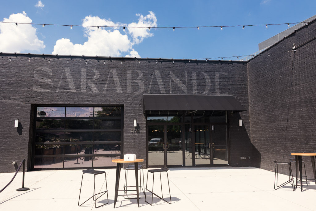 Exterior of Sarabande Chicago with patio area under a blue sky