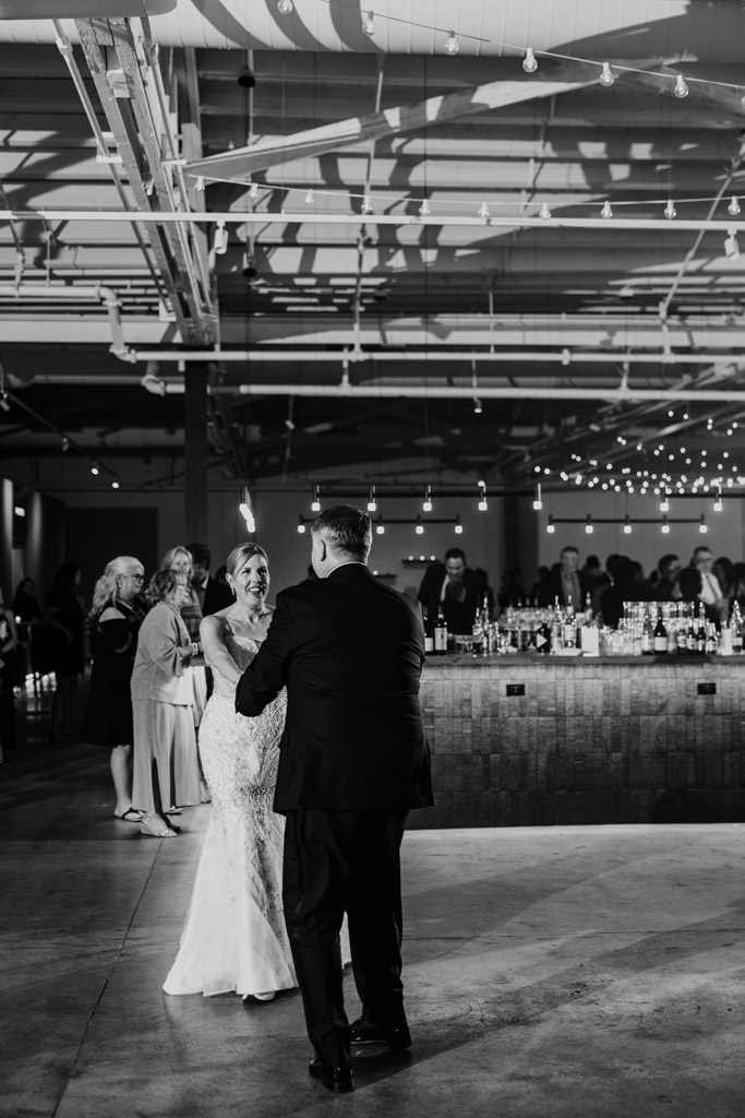 Black and white photo of bride and groom during their first dance at their wedding reception at Sarabande Chicago
