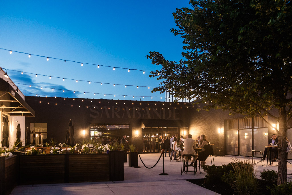Sarabande Chicago's outdoor patio at dusk with string lights