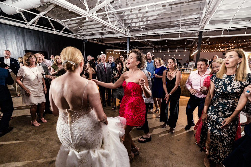 Bride and guests dance together at a lively Sarabande Chicago wedding reception