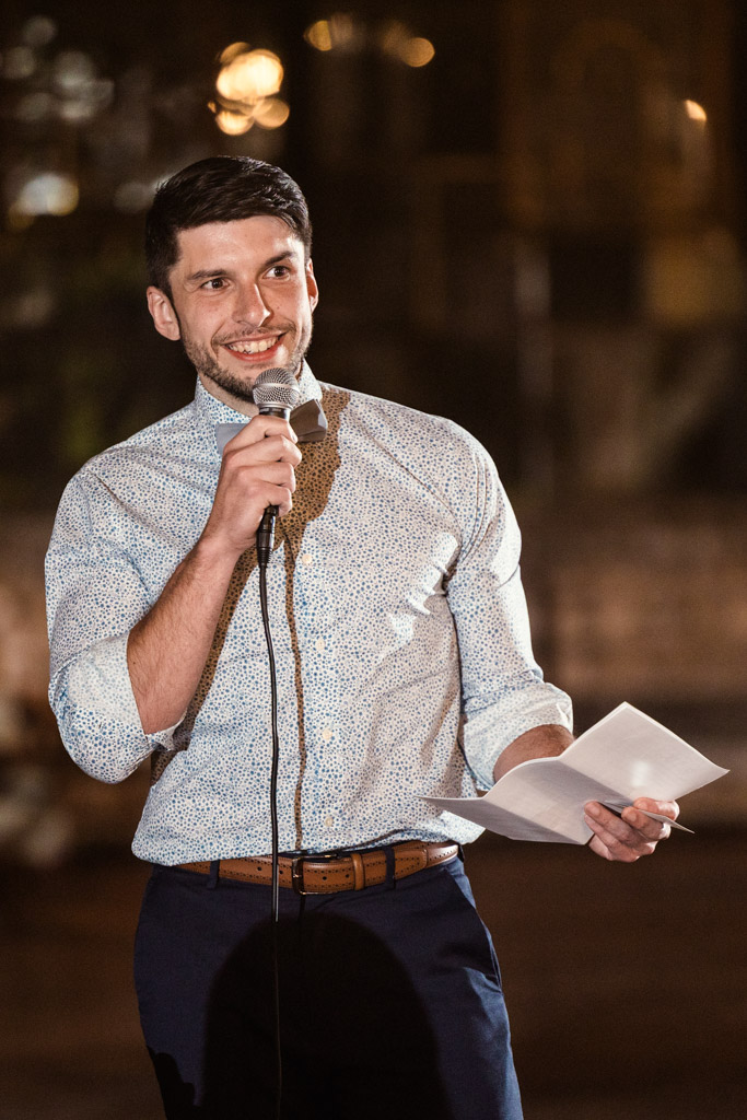 Guest gives speech during Salvage One wedding reception