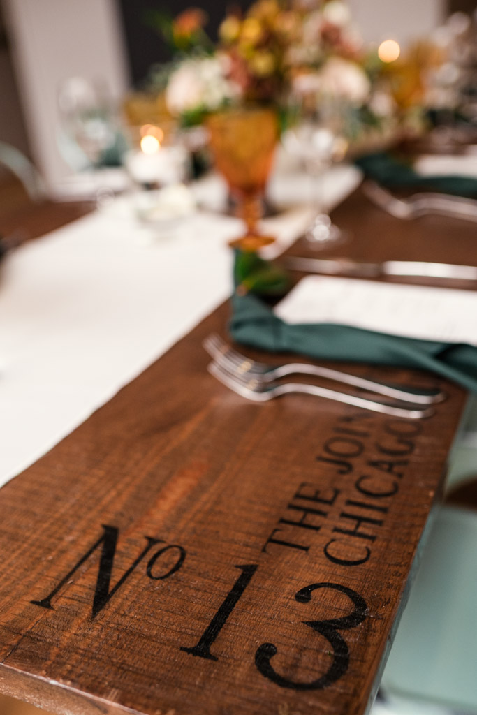 A wooden guest table marked 