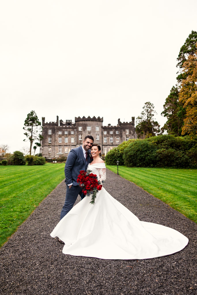 Portrait of bride and groom on a garden path in front of Markree Castle
