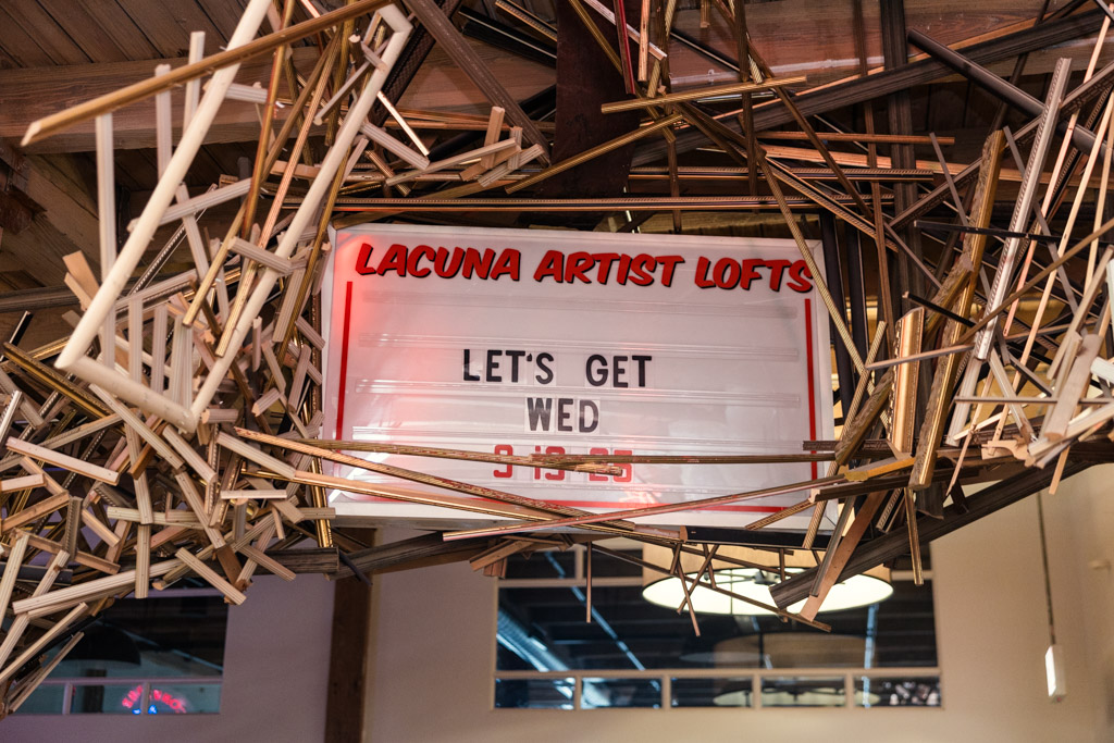 Wedding welcome sign at Lacuna Lofts surrounded by wooden picture frames