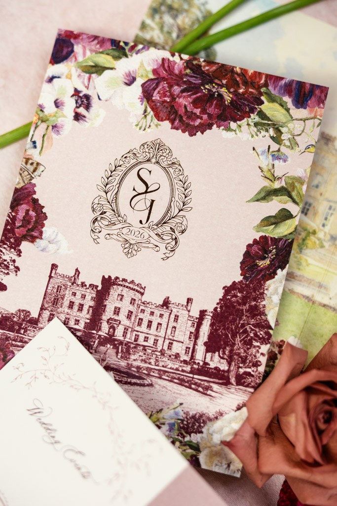 Floral-themed wedding invitation featuring an illustration of Markree Castle, monogram, and a rose
