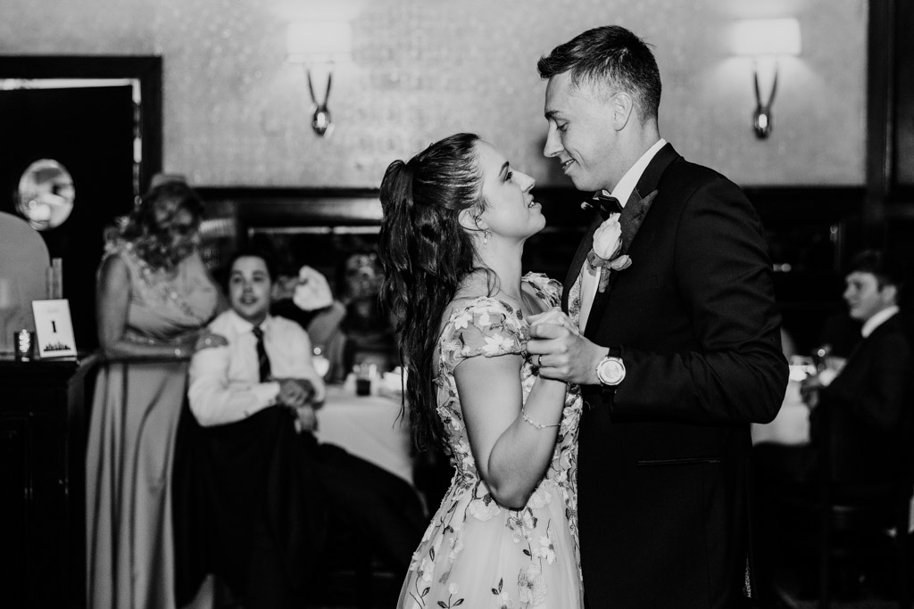 Black and white photo of newlyweds dancing closely during their Mon Ami Gabi wedding reception