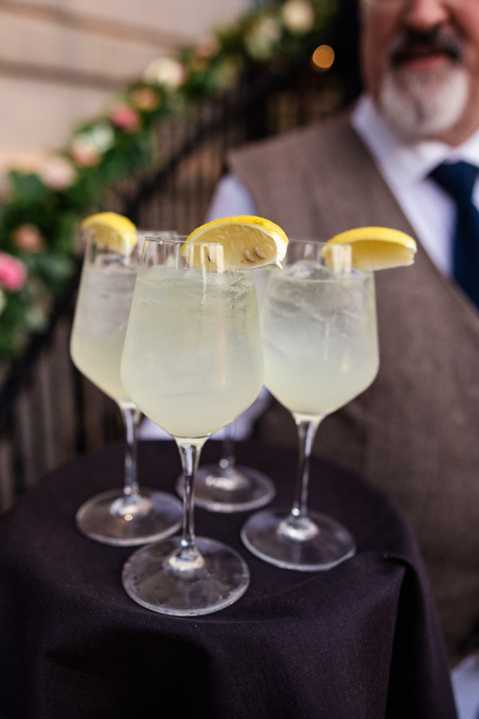 Glasses of lemonade with lemon wedges on a tray for Mon Ami Gabi wedding reception