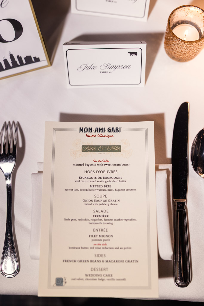 Wedding reception dinner menu rests on a white tablecloth at Mon Ami Gabi