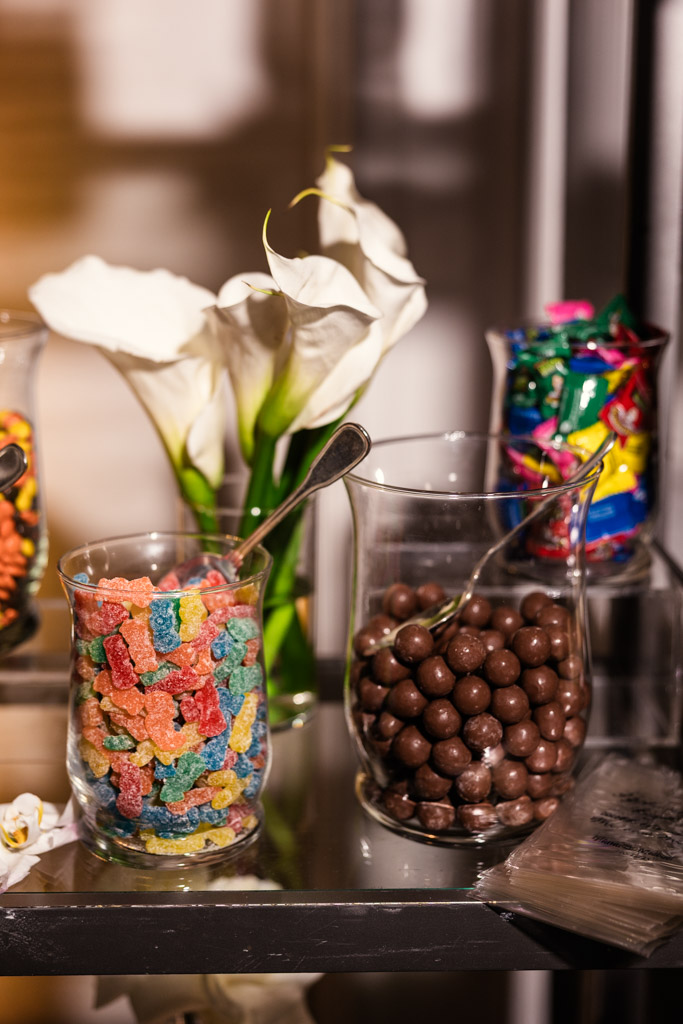 Glass jars filled with colorful gummy candies and chocolate balls for wedding reception at The Four Seasons Chicago