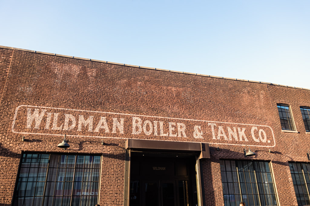 Brick building with a faded sign reading 