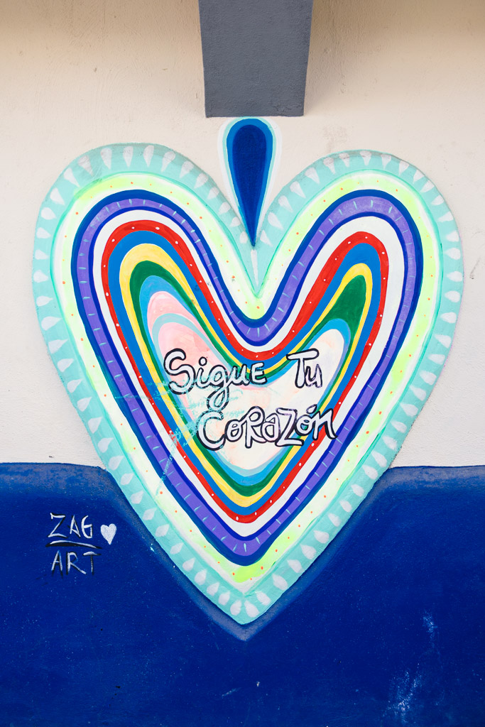 Colorful heart mural with the words 
