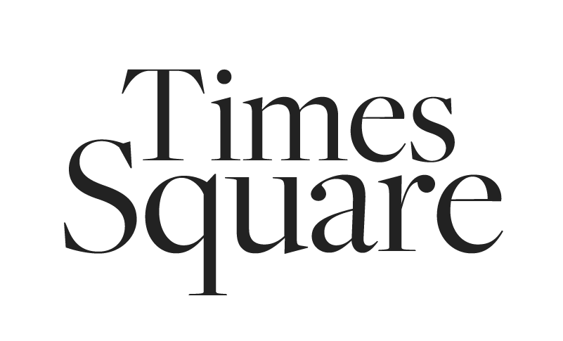 Black serif text says "Times Square" on a plain white background, reminiscent of the classic, timeless style favored by a documentary wedding photographer.