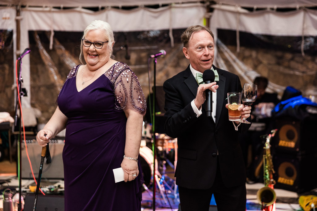Groom's parents give speech during wedding reception at Terra Mia Vineyard in Paso Robles, California