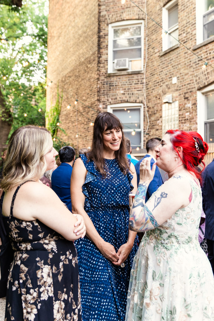Bride talks with guests at her Firehouse Chicago wedding reception