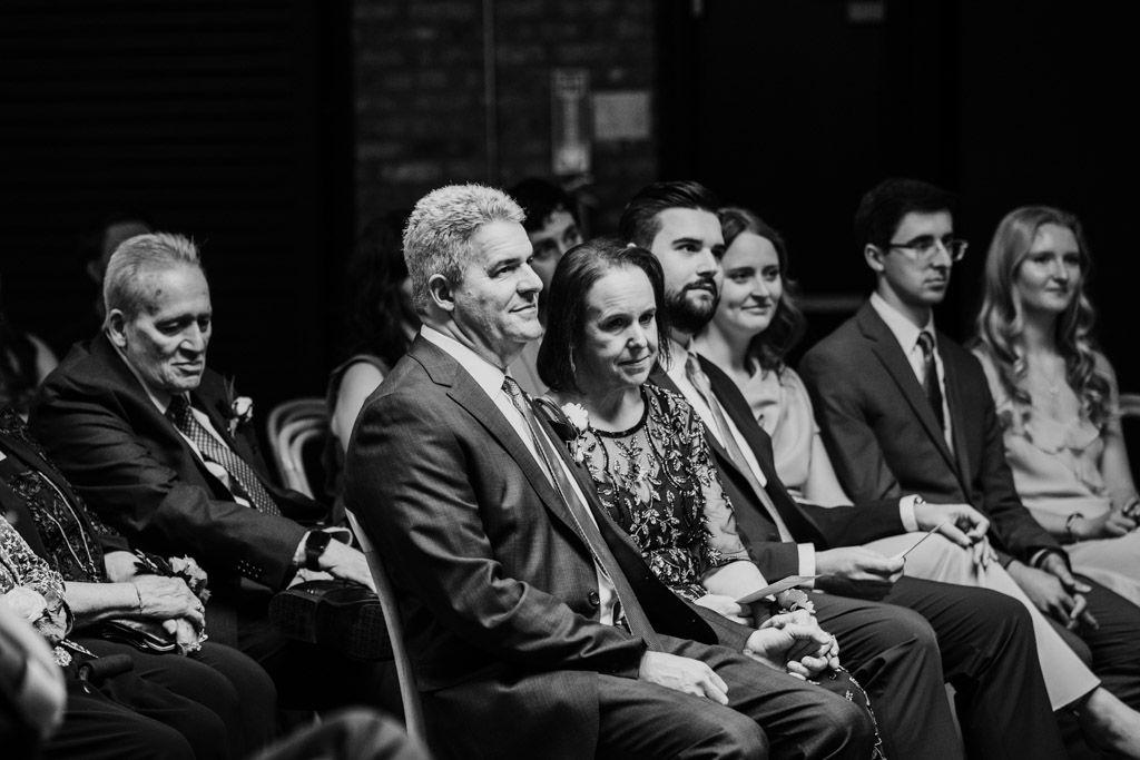 Black and white photo of groom's parents during wedding ceremony at The Arbory