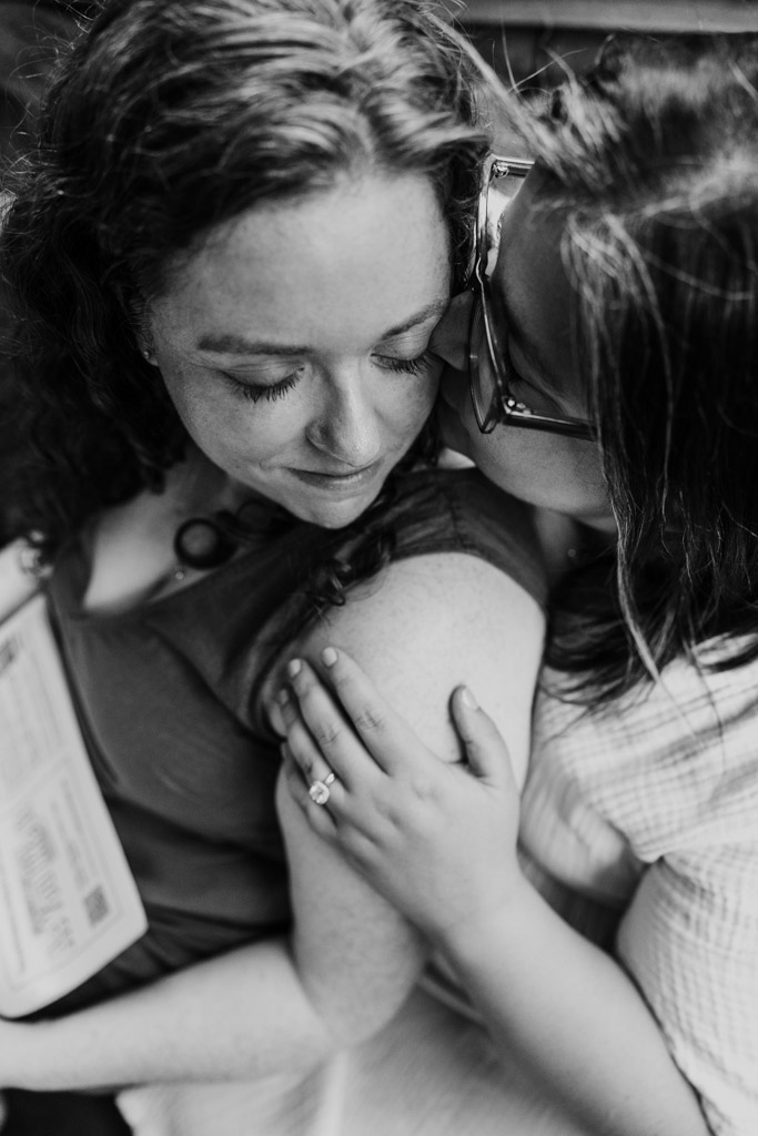 Black and white photo of two women holding each other closely during their Wicker Park engagement session