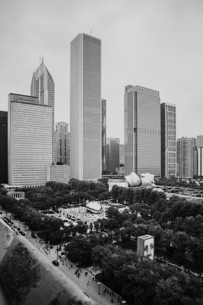 Black and white photo of Chicago skyscrapers and Millennium Park from a balcony at the University Club of Chicago