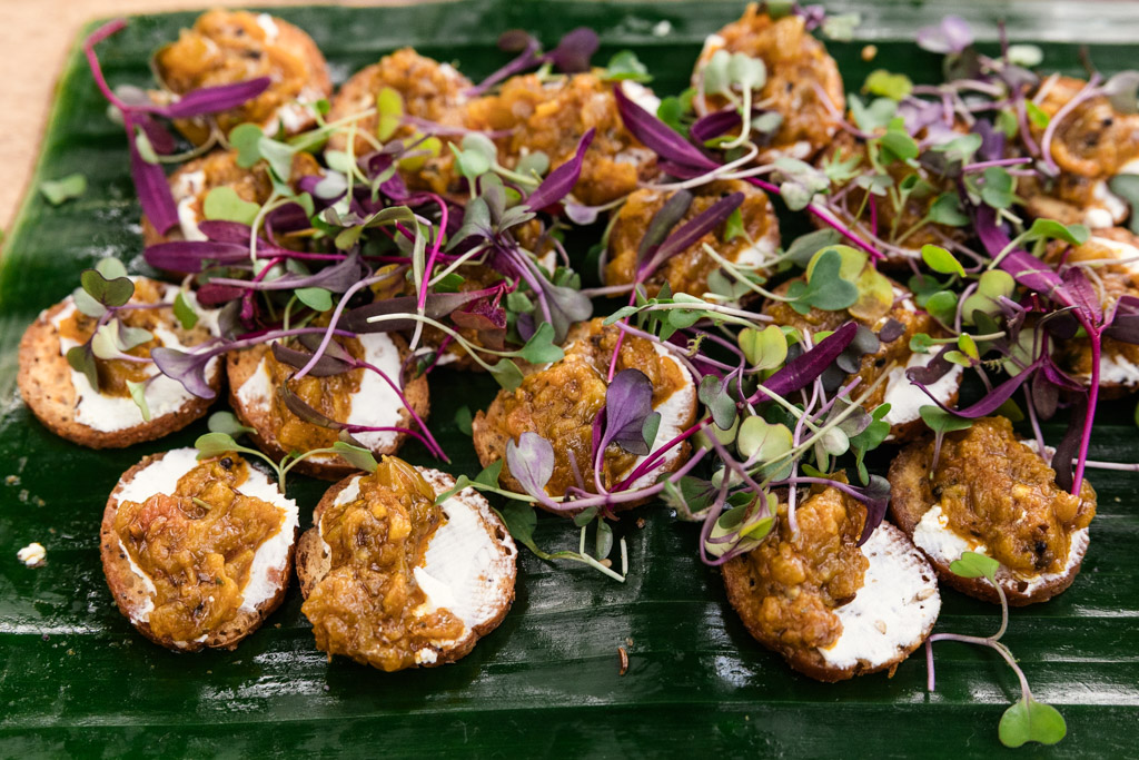 Appetizers on a green leaf for a Chicago Indian wedding reception at Garfield Park Conservatory