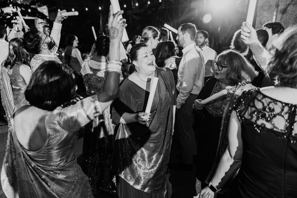 Black and white photo of guets on the dance floor during Indian wedding reception at Garfield Park Conservatory