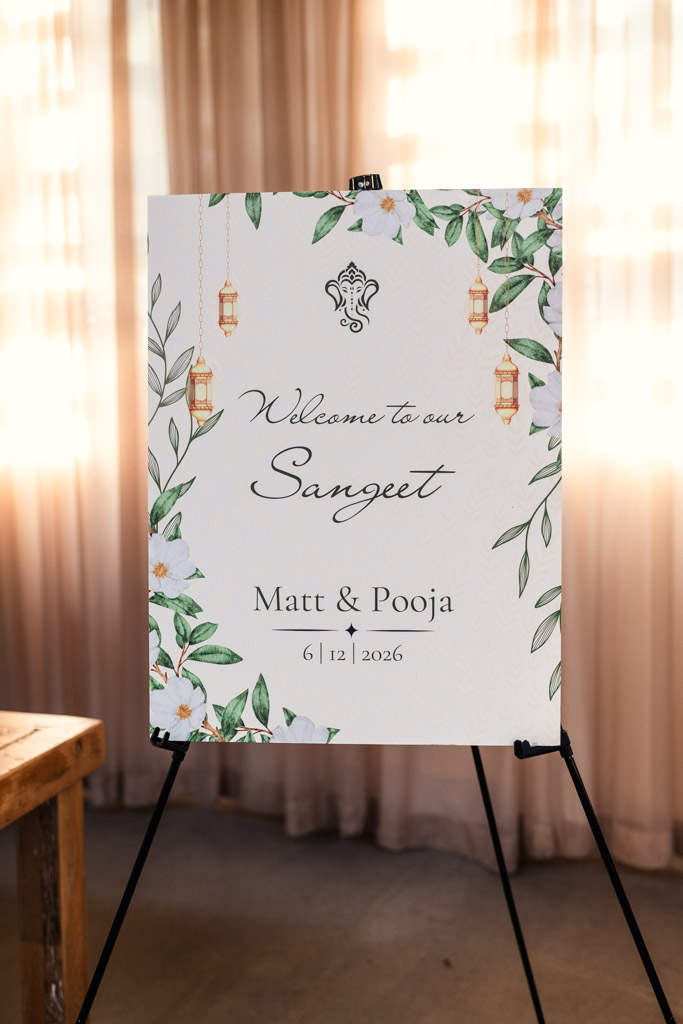 Sangeet welcome sign decorated with flowers, leaves, and lanterns at Ovation Chicago