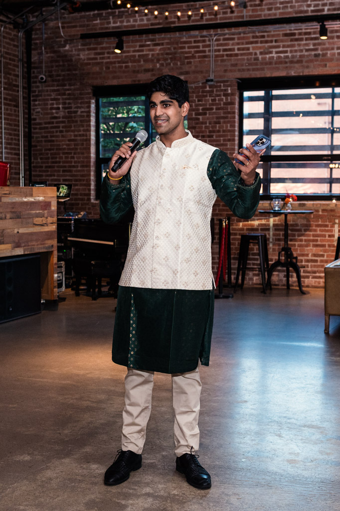 A man in traditional Indian attire gives speech during Sangeet at Ovation Chicago